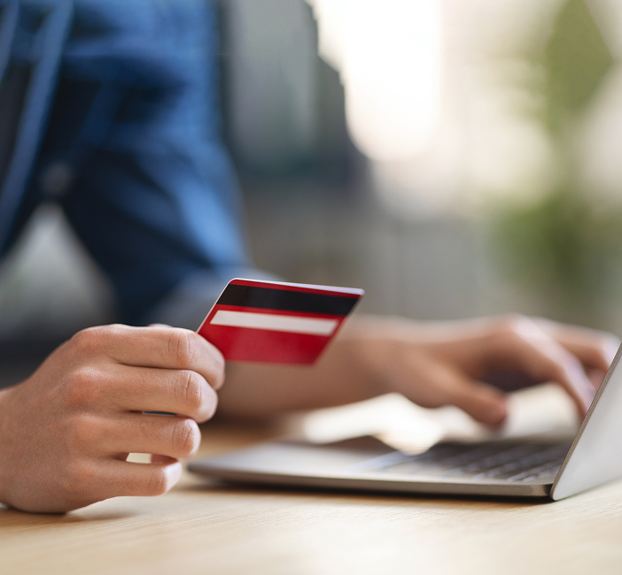 online-shopping-closeup-shot-man-using-credit-card-laptop-(1) 1