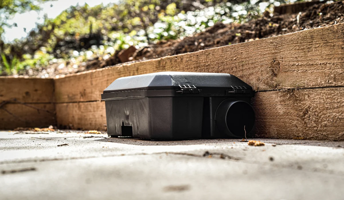 rodent bait and trap station being used outside